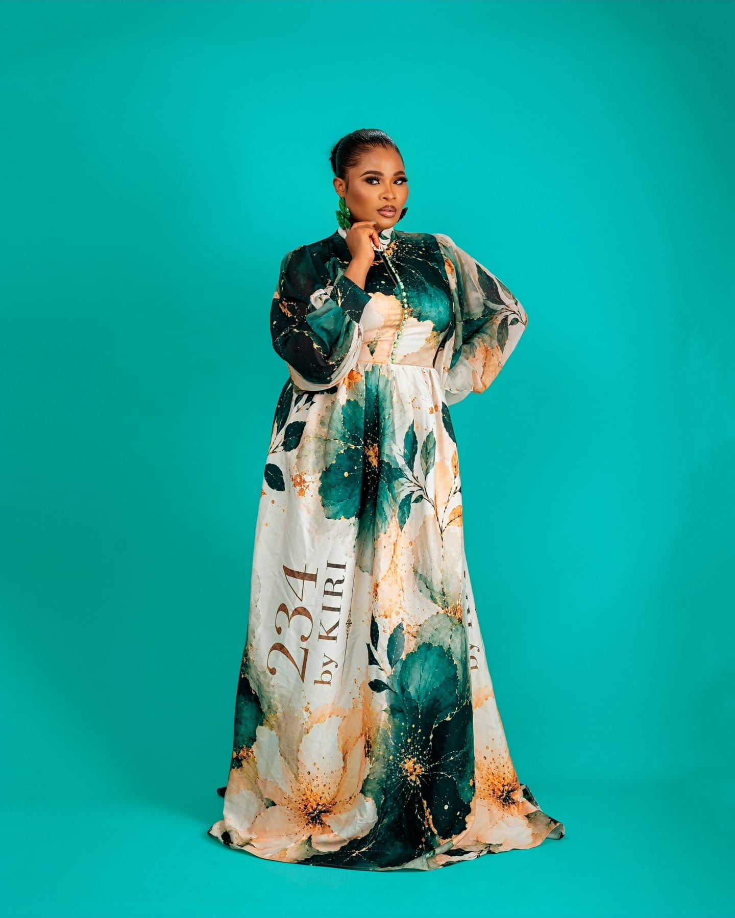 Teal floral Bloom Royale gown on the studio floor (frame 4 of 9)