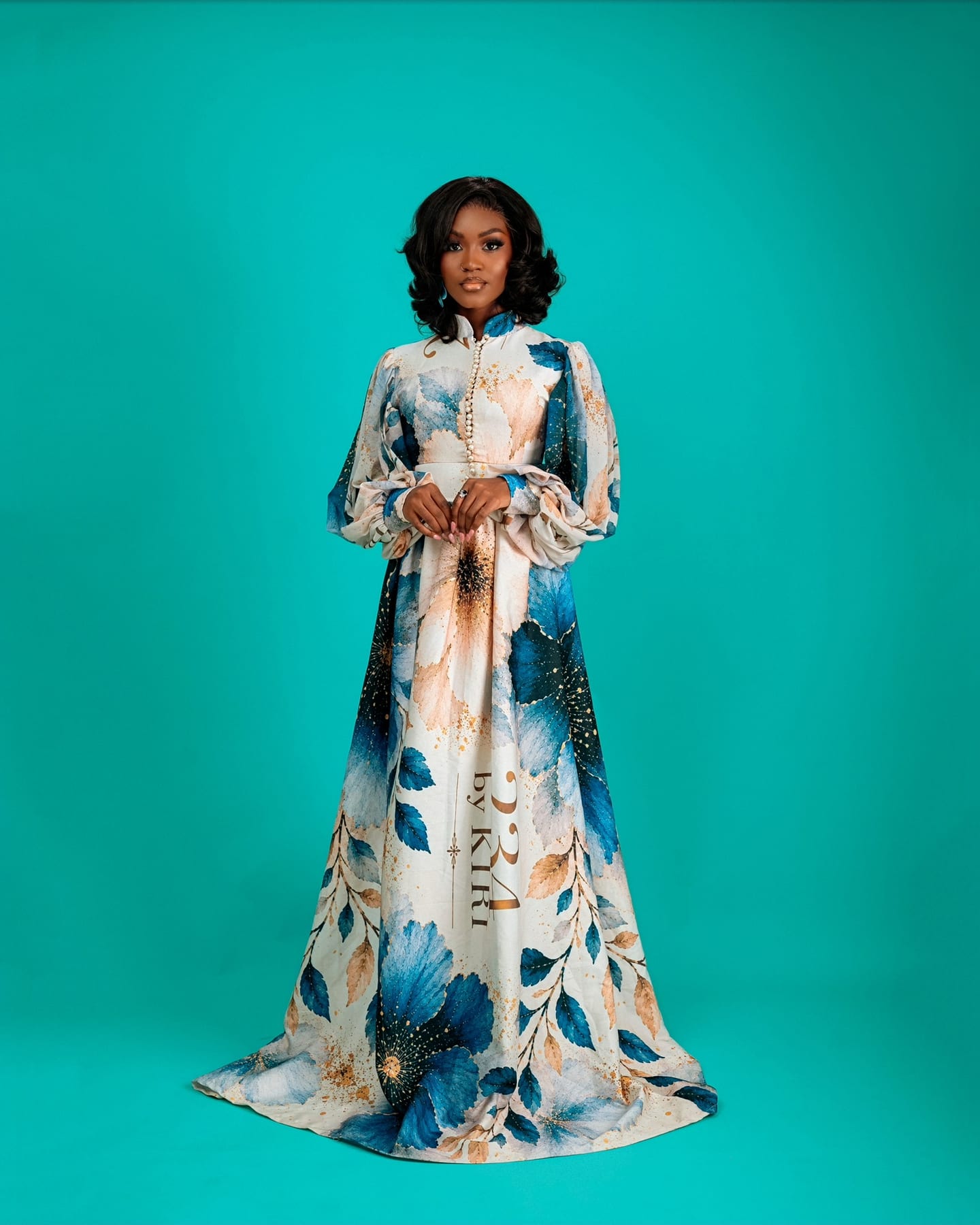 Teal floral Bloom Royale gown on the studio floor (frame 6 of 9)