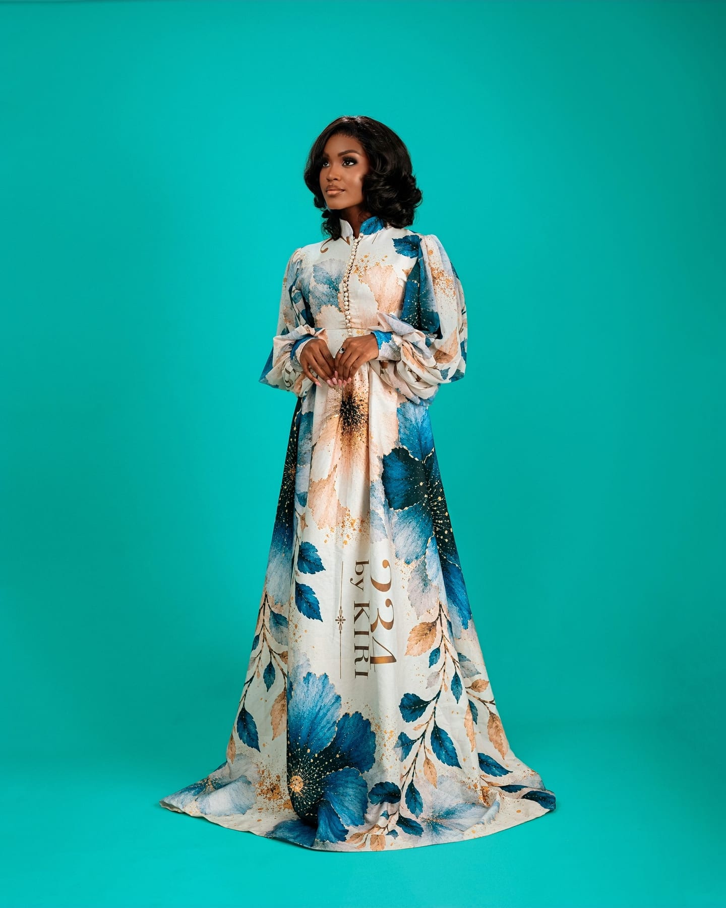 Teal floral Bloom Royale gown on the studio floor (frame 7 of 9)